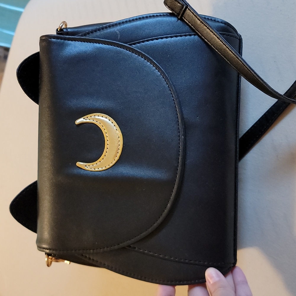 Hand bag. Moon on front-similar to moon on sailor moon's crescent. Cat ears.